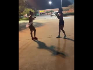 girl ditches top to fight